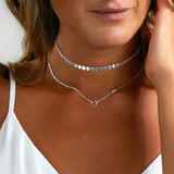 Silver Layered Disc Choker With A Karma Pendant layered necklace