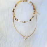 Gold layered disc choker with a karma pendant layered necklace