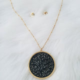 Large black and gold leather necklace with chic gold stud earrings jewelry set