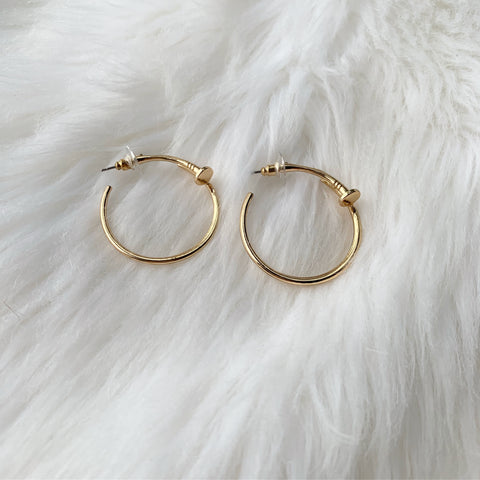 Gold nail earrings